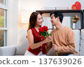 Happy asian woman receiving rose bouquet from boyfriend with celebrating Valentine's Day. 137639026