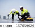 Solar panel installer engineer team installing photovoltaic system renewable energy power rooftop. 137639029