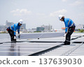 Caucasian worker team installing solar cell for sustainable energy power. 137639030