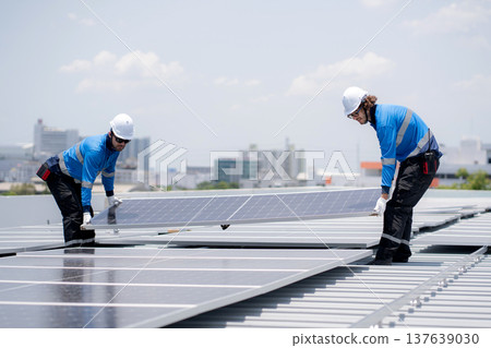 Caucasian worker team installing solar cell for sustainable energy power. Caucasian worker team installing solar cell for sustainable energy power. 137639030