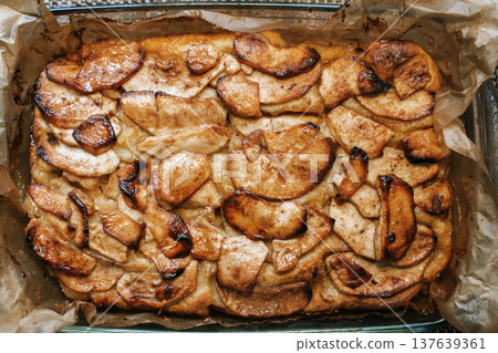 Rustic Homemade Apple Pie with Golden Crust on a Wooden Kitchen Table. High quality photo 137639361