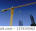 Tower Crane Operating on an Active Urban Construction Site. High quality photo 137639362