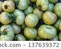 Fresh Green Tomatoes in Wooden Crates at Local Farmers Market. High quality photo 137639372