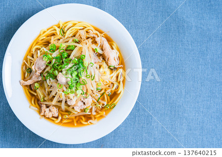 Soy sauce ramen topped with bean sprouts and pork, a classic Japanese noodle dish Soy sauce ramen topped with bean sprouts and pork, a classic Japanese noodle dish 137640215