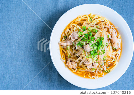 Soy sauce ramen topped with bean sprouts and pork, a classic Japanese noodle dish Soy sauce ramen topped with bean sprouts and pork, a classic Japanese noodle dish 137640216