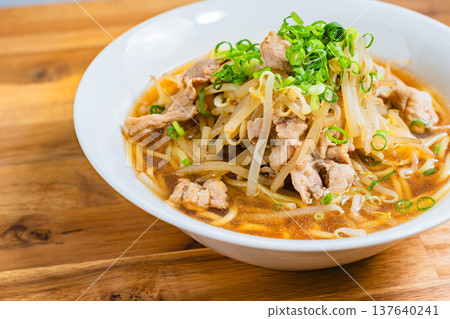 Soy sauce ramen topped with bean sprouts and pork, a classic Japanese noodle dish 137640241