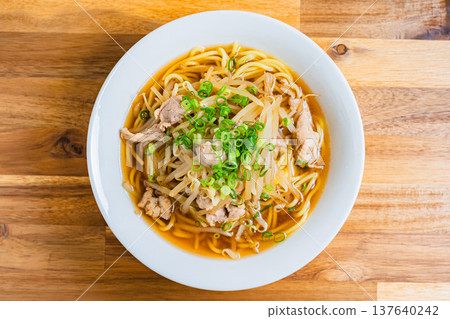 Soy sauce ramen topped with bean sprouts and pork, a classic Japanese noodle dish Soy sauce ramen topped with bean sprouts and pork, a classic Japanese noodle dish 137640242