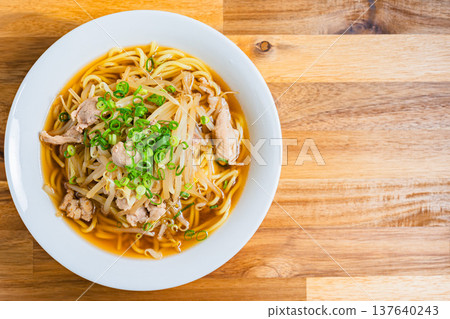 Soy sauce ramen topped with bean sprouts and pork, a classic Japanese noodle dish 137640243