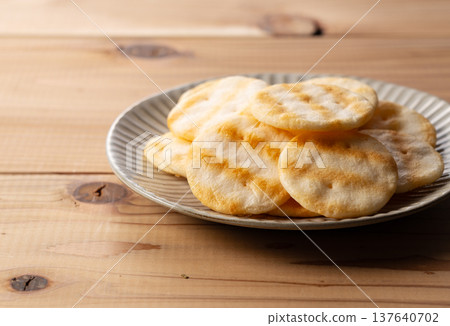 Delicious-looking rice crackers arranged on a plate 137640702