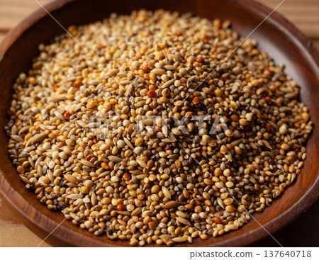 Bird food served on a wooden plate Bird food served on a wooden plate 137640718