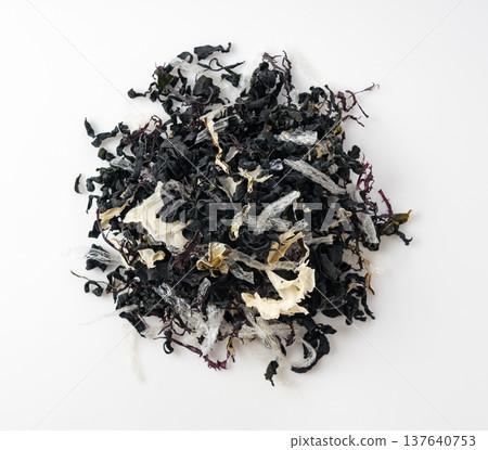 Aerial view of dried seaweed salad served on a white background Aerial view of dried seaweed salad served on a white background 137640753