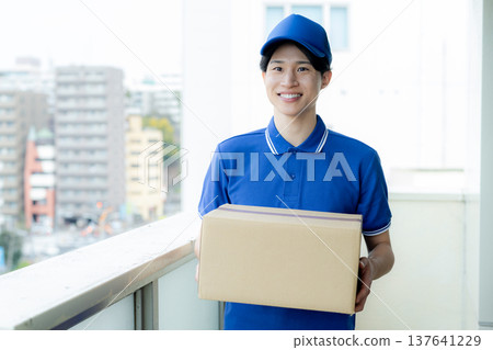 A young man delivering a package 137641229