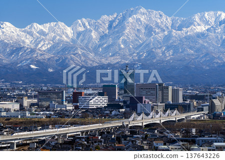 View of Toyama city, the Hokuriku Shinkansen, and the Tateyama mountain range from Mt. Kureha 137643226
