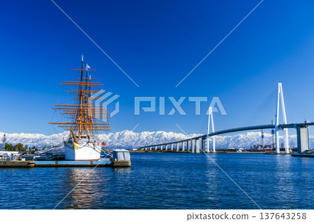 The Lady of the Sea, the Kaiwo Maru, the Shinminato Bridge, and the Tateyama Mountain Range The Lady of the Sea, the Kaiwo Maru, the Shinminato Bridge, and the Tateyama Mountain Range 137643258