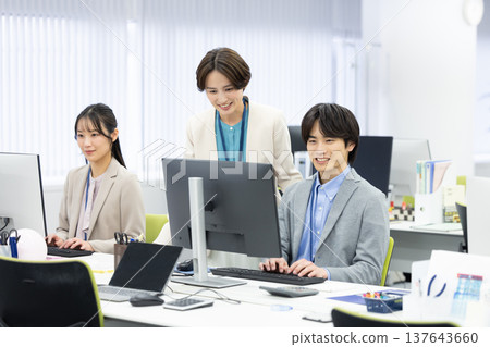 Men and women working in business offices Men and women working in business offices 137643660