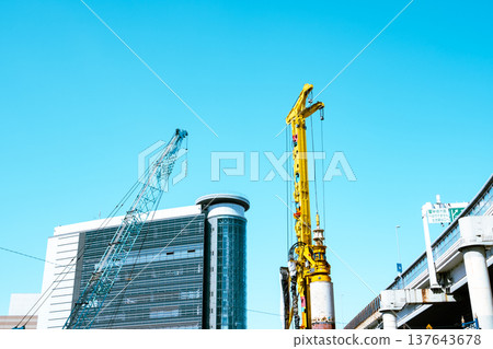 Ikebukuro under redevelopment: Heavy machinery, buildings, and highways. February 2026. Light color. Ikebukuro under redevelopment: Heavy machinery, buildings, and highways. February 2026. Light color. 137643678