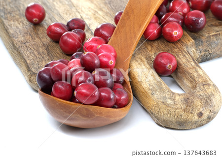 Rustic Cranberry Scoop On Wooden Board With Fresh Red Berries For Holiday Cooking 137643683