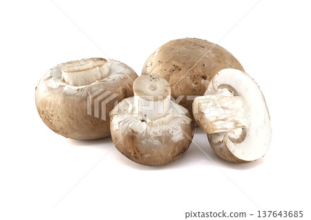 A group of fresh, whole and sliced cremini mushrooms on a clean white background 137643685