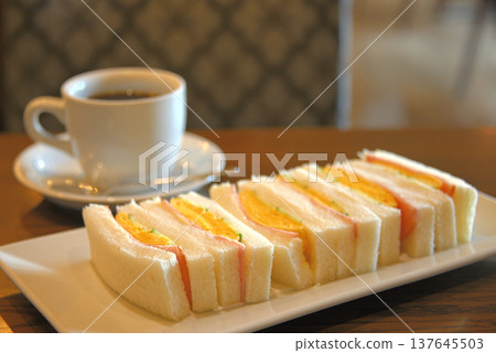 Egg sandwich and coffee breakfast 1 137645503