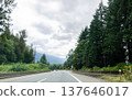Highway in Hope  BC, Canada with cloud covered mountains in the background 137646017