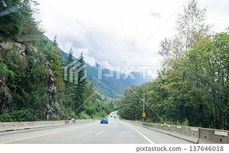 Highway in Hope BC, Canada with cloud covered mountains in the background Highway in Hope BC, Canada with cloud covered mountains in the background 137646018