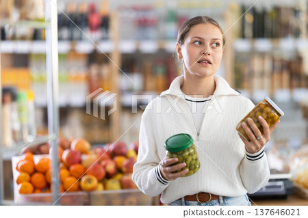 customer holds olives customer holds olives 137646021