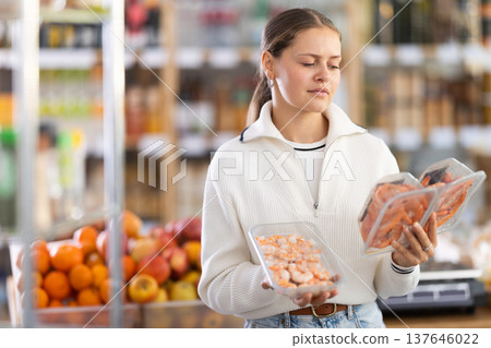 Woman choosing shrimp Woman choosing shrimp 137646022