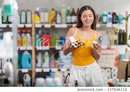 Young woman choosing cosmetics in household chemicals store 137646118