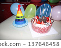 A birthday cake decorated on a whole birthday cake. 137646458