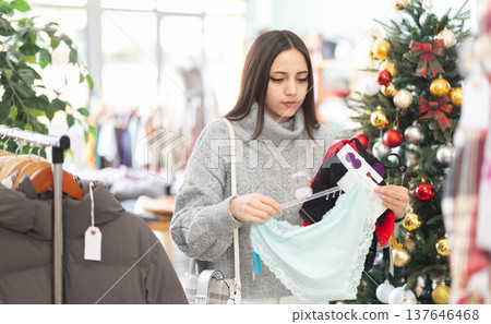 Young girl choosing panties in clothing store 137646468