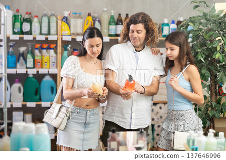 Thoughtful family choosing liquid soap in household store 137646996