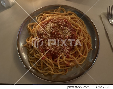 Creamy and rich spaghetti coated in a luscious white sauce, offering a smooth and savory flavor perfect for a comforting and satisfying meal. Creamy and rich spaghetti coated in a luscious white sauce, offering a smooth and savory flavor perfect for a comforting and satisfying meal. 137647276