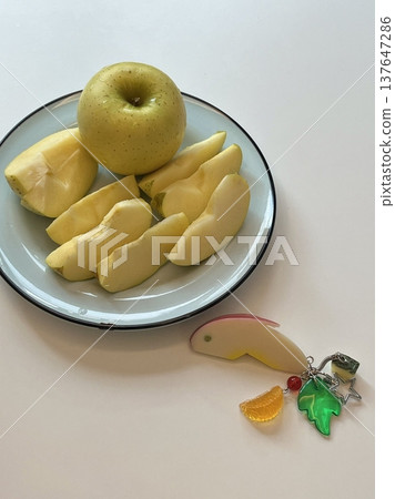Freshly sliced apple pieces with crisp texture and natural sweetness, beautifully arranged. A healthy and refreshing snack perfect for any time of the day. 137647286