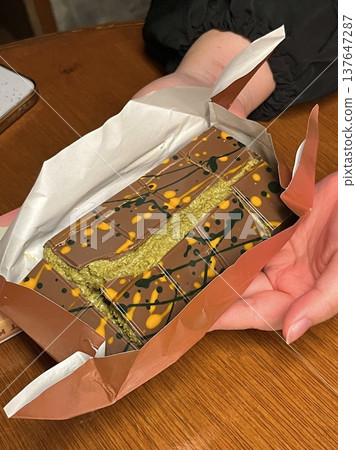 Dubai chocolate, known for its luxurious and rich flavors, often presented in elegant packaging. Made with high-quality ingredients, it offers a smooth texture and indulgent taste perfect for gifting Dubai chocolate, known for its luxurious and rich flavors, often presented in elegant packaging. Made with high-quality ingredients, it offers a smooth texture and indulgent taste perfect for gifting 137647287