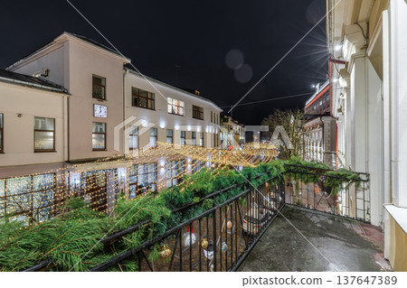 Festive Night Cityscape View from Decorated Christmas Balcony Festive Night Cityscape View from Decorated Christmas Balcony 137647389