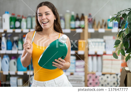 Girl view trademark sign on label, pick eco friendly liquid detergent 137647777