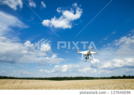 The drone copter flying with digital camera. 137648096