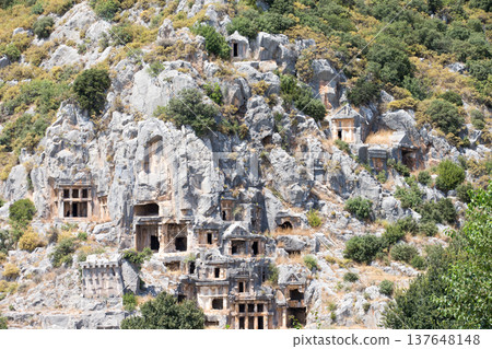 Ancient lycian necropolis with tomb carved in rocks in Mira 137648148