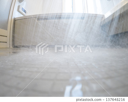 Shower scene with water splashing onto the floor 137648216