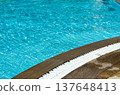 Water in swimming pool rippled water detail background.  Blue in the water in the swimming pool. 137648413