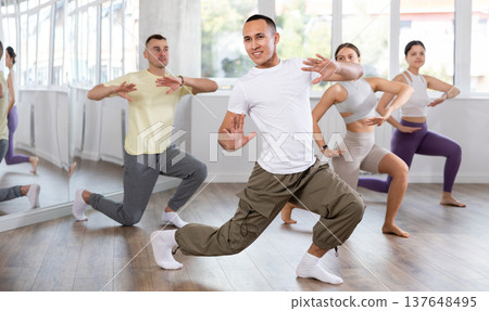 Young Asian man practicing aerobic dance in training hall 137648495