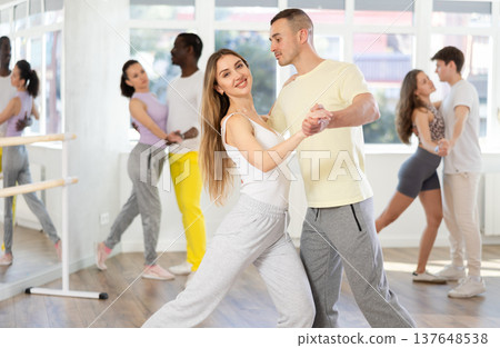 Young man and woman dancing latin dances Young man and woman dancing latin dances 137648538