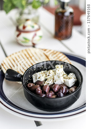 marinated olives and feta cheese tapas snack at outdoor restaurant in mykonos greece marinated olives and feta cheese tapas snack at outdoor restaurant in mykonos greece 137649168