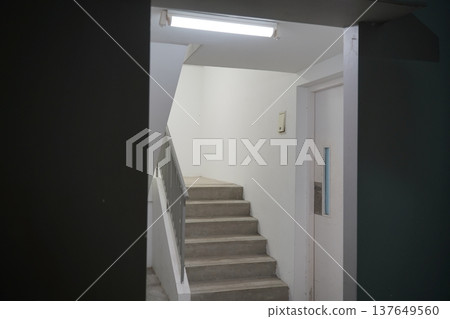 Minimalist Stairwell in Apartment Building Interior Minimalist Stairwell in Apartment Building Interior 137649560