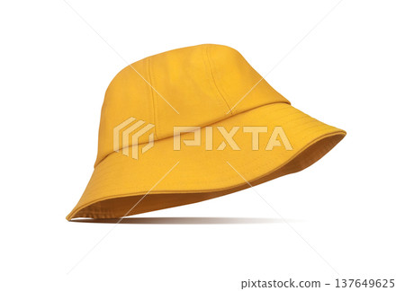 A yellow bucket hat placed stylishly against a white background. A yellow bucket hat placed stylishly against a white background. 137649625