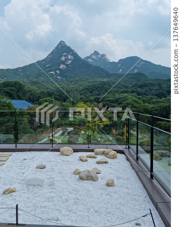 This is a rooftop with a view of Mt. Bukhan. 137649640