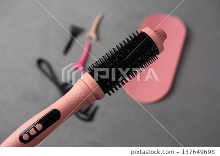 Solution for frizzy hair. Pink electric multi styler with round brush. Complete set with comb and clips transforms unruly hair into smooth, shiny, perfect style. Professional result at home 137649698