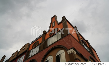Building Architecture with Cloudy Sky Above Scenery Building Architecture with Cloudy Sky Above Scenery 137649742