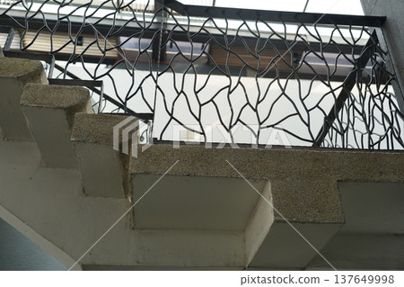 Staircase with Ornate Metal Railing Architecture Detail 137649998