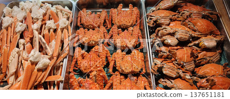 Trays of fresh crabs arranged for seafood barbecue at a restaurant in Sapporo, Japan, showcasing delicious seafood cuisine and buffet-style dining Trays of fresh crabs arranged for seafood barbecue at a restaurant in Sapporo, Japan, showcasing delicious seafood cuisine and buffet-style dining 137651181
